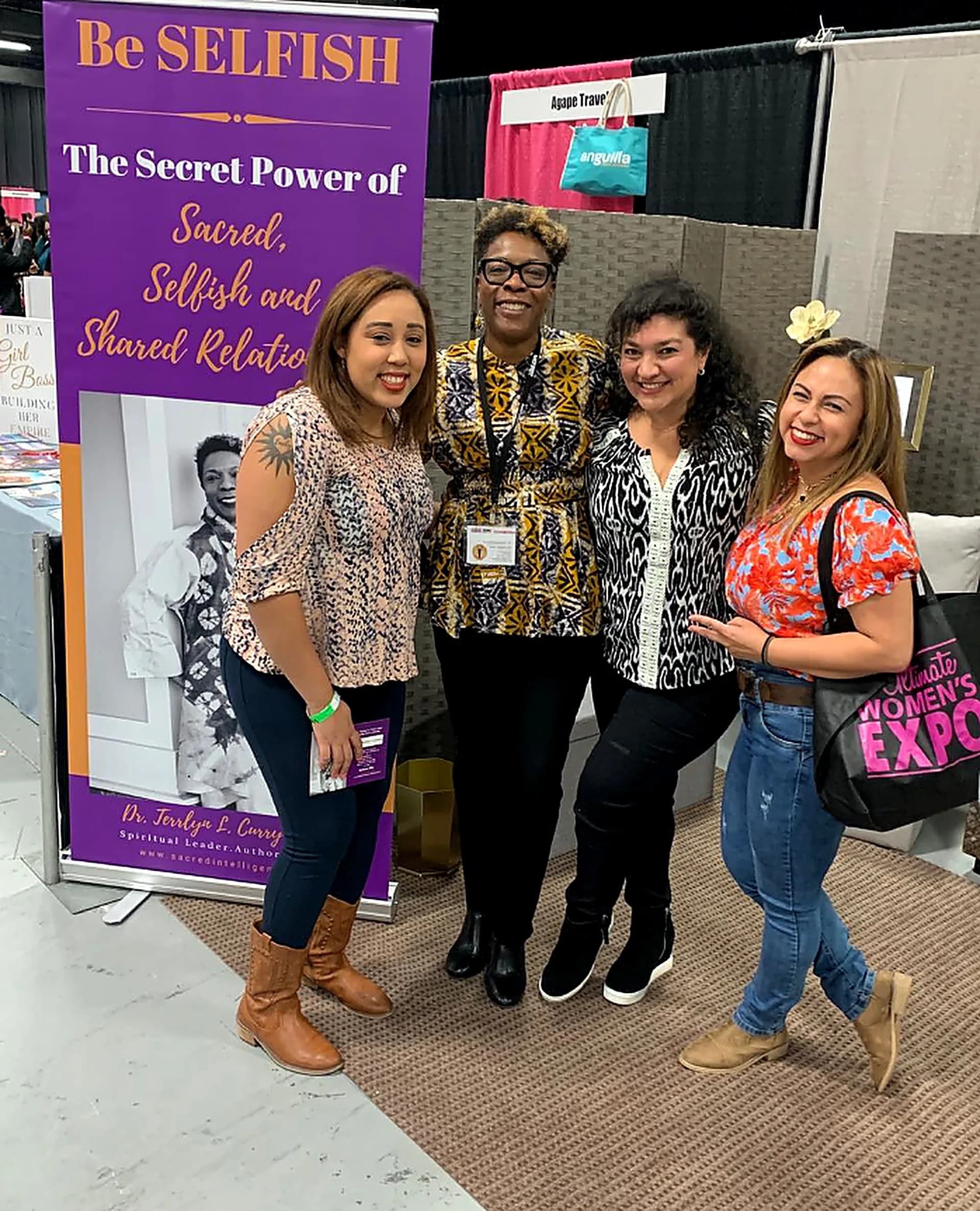 Dr. TLC at the Women's Expo with the Be Selfish banner